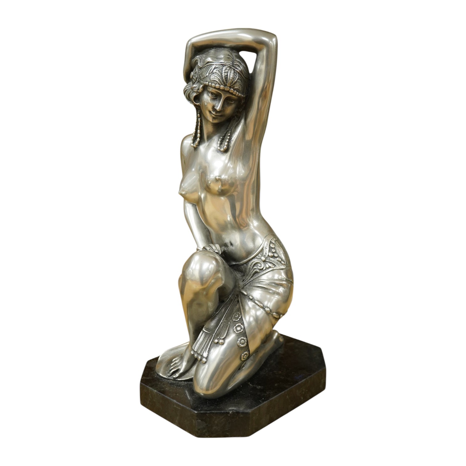 An Art Deco style figure of semi nude woman, raised on shaped marble base, in the style of Giuseppe Bessi, 37cm high. Condition - good